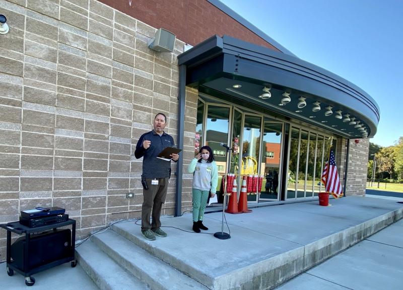H.O. Brittingham physical education teacher Bill Funkhouser welcomes participants to the Special Olympics bocce tournament while third-grader Bonita Johnson prepares to lead players in reciting the Special Olympics pledge.